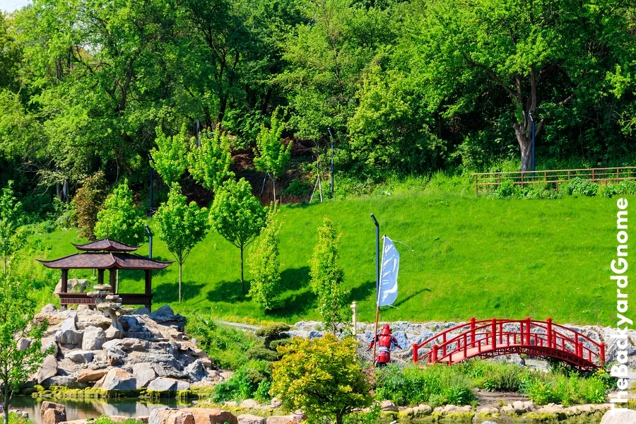 Red bridge and gazebo by a pond in Japanese garden - Part 2