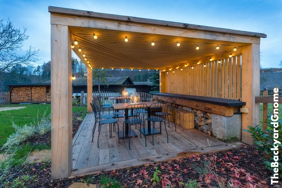 Gazebo with lights/gazebo at night/a gazebo lit up at night Picture of a summer house with comfortable garden furniture. Romantic scene in dusk - Part 1