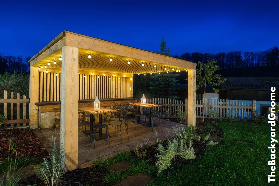 Gazebo with lights/gazebo at night/a gazebo lit up at night Picture of a summer house with comfortable garden furniture. Romantic scene in dusk - Part 2